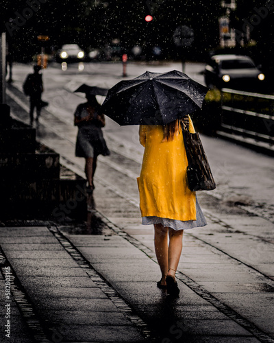 woman walking in the rain