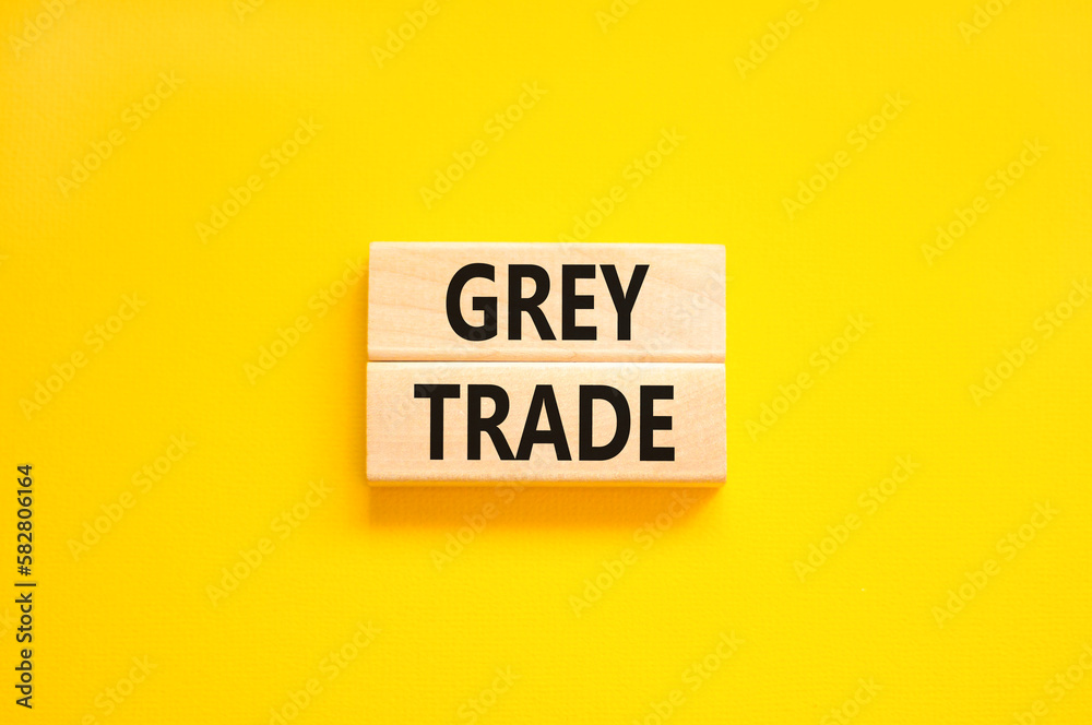 Grey trade symbol. Concept words Grey trade on wooden block. Beautiful yellow table yellow background. Business grey trade concept. Copy space. Grey trade symbol. Concept words Grey trade on wooden block. Beautiful yellow table yellow background. Business grey trade concept. Copy space.