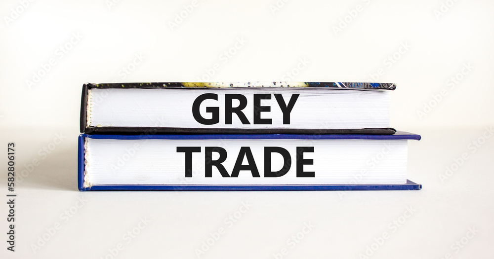 Grey trade symbol. Concept words Grey trade on books. Beautiful white table white background. Business grey trade concept. Copy space.