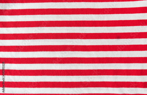 Fabric sample in red white horizontal stripe with worked. Background, texture.