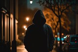 Enigmatic Presence Along the Sidewalks: A Dusky Silhouette in a Hoodie Generative AI