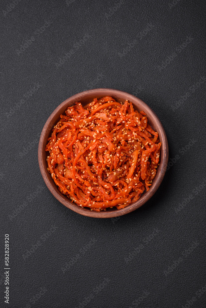 Dried squid chopped into slices and seasoned with sesame seeds and spices Dried squid chopped into slices and seasoned with sesame seeds and spices