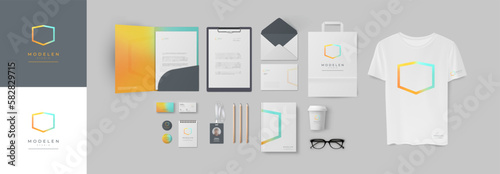 Colorful blue and orange corporate design with geometric logo and bright background. Corporate identity in gradient style with folder and business cards, envelope and notepad, form A4 and paper bag