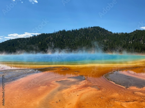 Blue steam rise from grand prismatic spring in Yellowstone National Park 