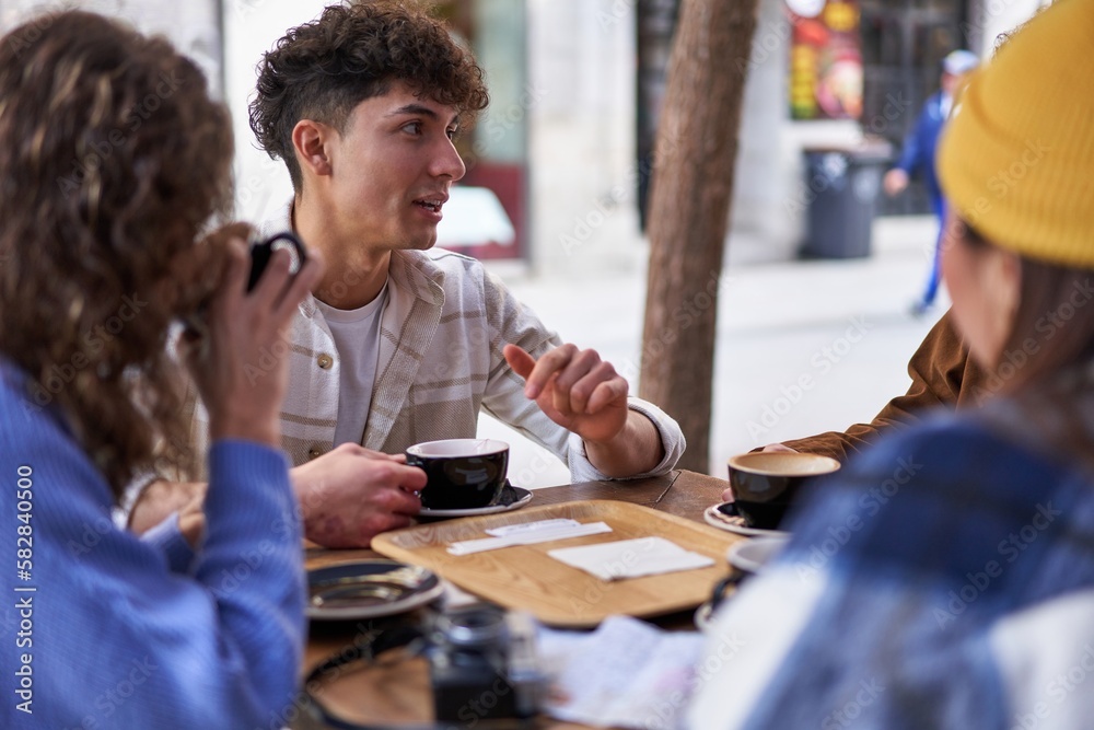 Friends from different cultures enjoy coffee and tea together.