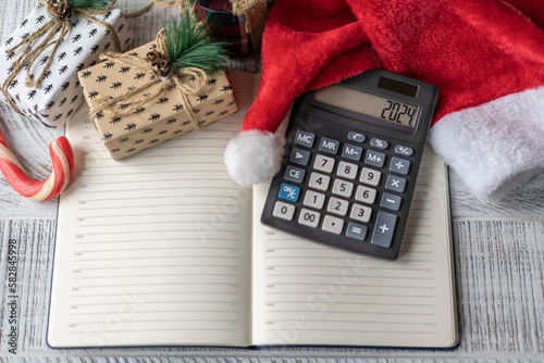 New Year's layout with calculator, Santa's hat and Christmas decorations