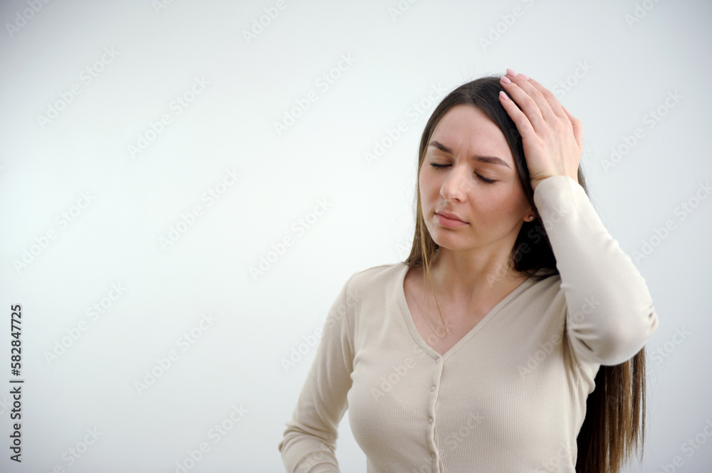 headache cute woman holding her head with her eyes closed cold treatment medicines place for text on a white background workdays Woman with headache rubbing temples. High quality photo headache cute woman holding her head with her eyes closed cold treatment medicines place for text on a white background workdays Woman with headache rubbing temples. High quality photo