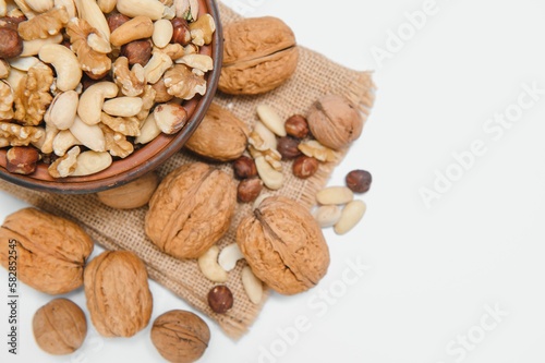 Various nuts on a plate, top view.