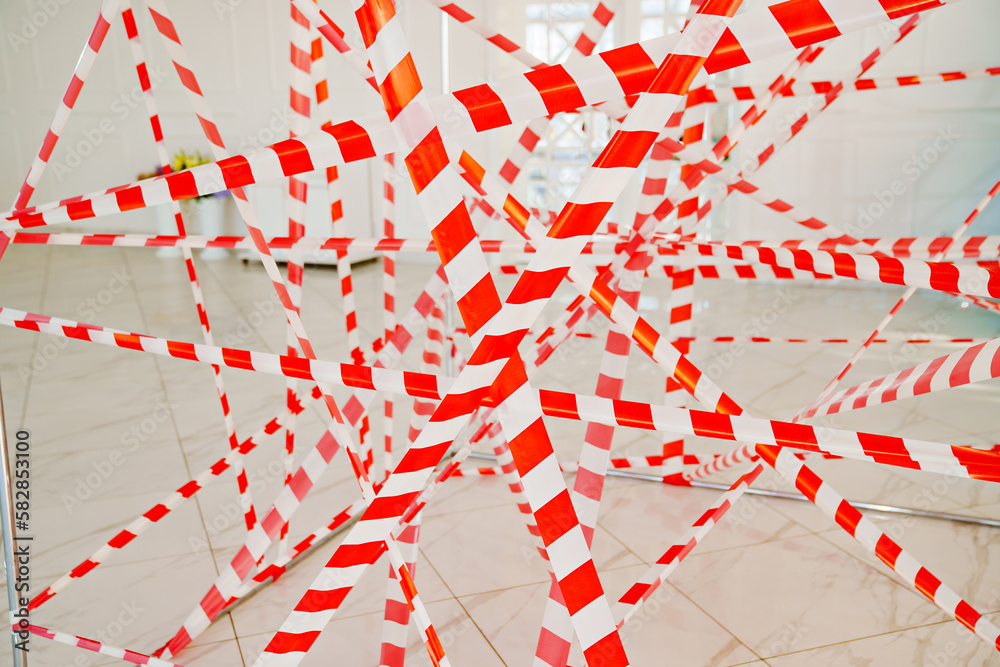 Naklejka premium Signal Tape. the fence tape is brightly colored, with alternating stripes.