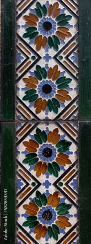 Green, white, blue and orange mosaic column