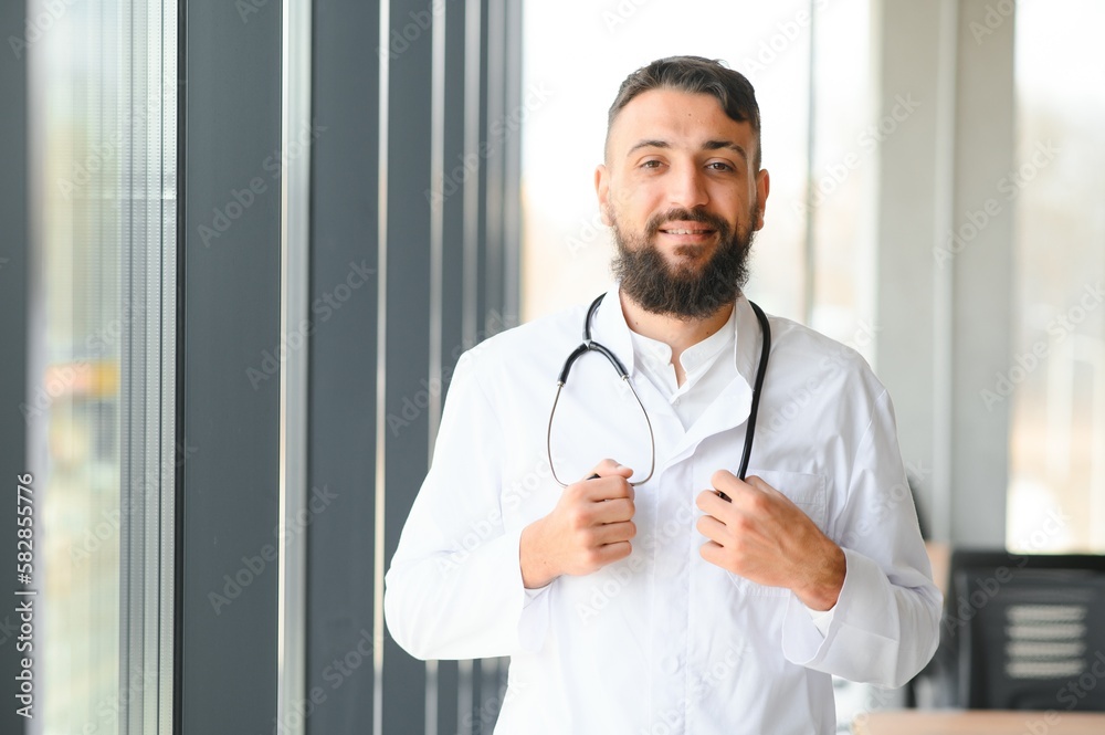 Portrait of a young Arab doctor in the clinic. Healthcare concept