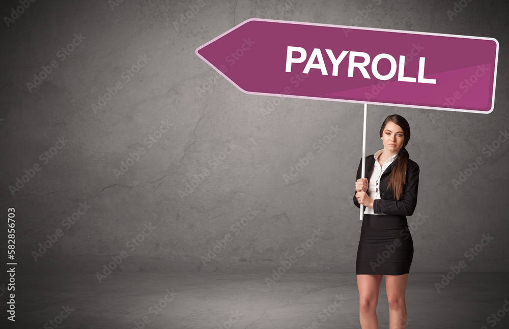 Young business person in casual holding road sign
