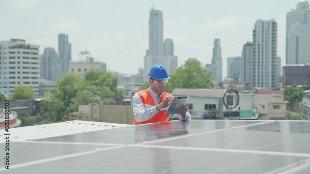 Foreman and Worker maintaining solar energy panel. Male engineers using tablet and radio in the area of the solar panel. Foreman and Worker maintaining solar energy panel. Male engineers using tablet and radio in the area of the solar panel.