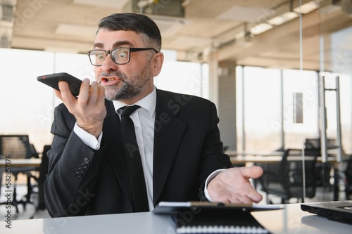 Corporate mad people yell authority tell speak with staff people person concept. Side profile view portrait of disappointed tired busy sad upset agent financier shouting on receiver in his hand