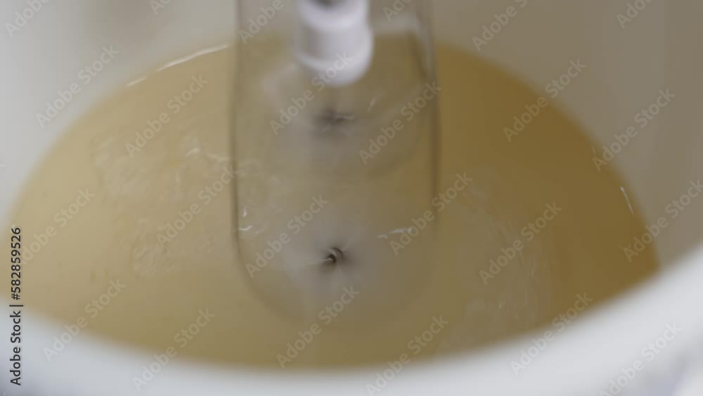 sugar syrup whipped in a bowl of a mixer to make marshmallow sugar syrup whipped in a bowl of a mixer to make marshmallow