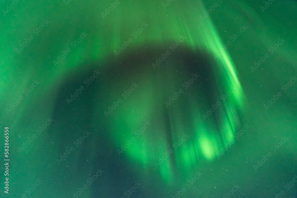 An Aurora borealis swirl in the sky near Riisitunturi National Park, Northern Finland