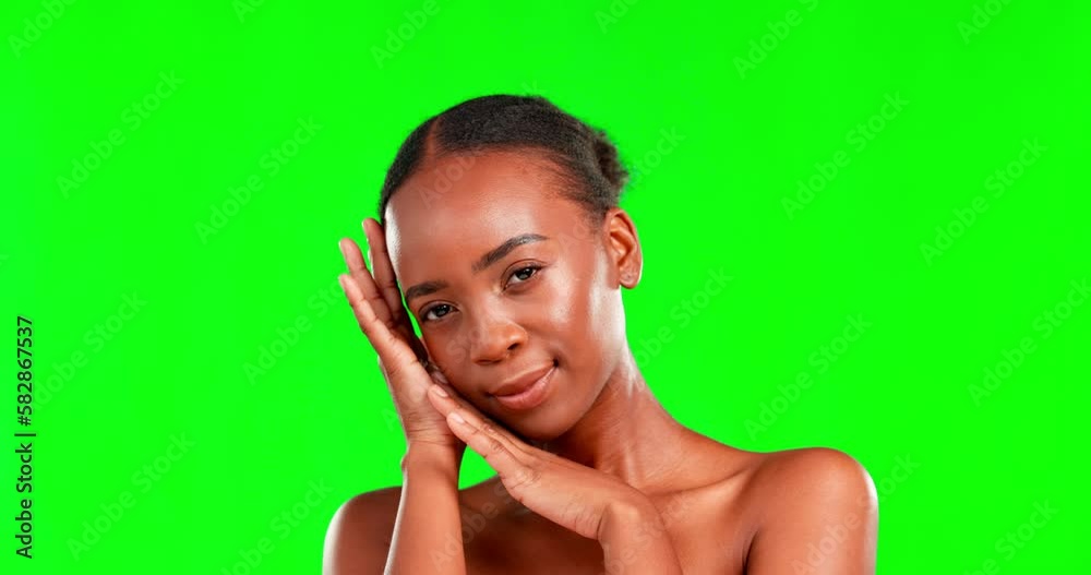 Face, skincare and a black woman on a green screen background in studio for natural or real beauty. Portrait, facial and chromakey mockup with an attractive young female touching her smooth skin Face, skincare and a black woman on a green screen background in studio for natural or real beauty. Portrait, facial and chromakey mockup with an attractive young female touching her smooth skin