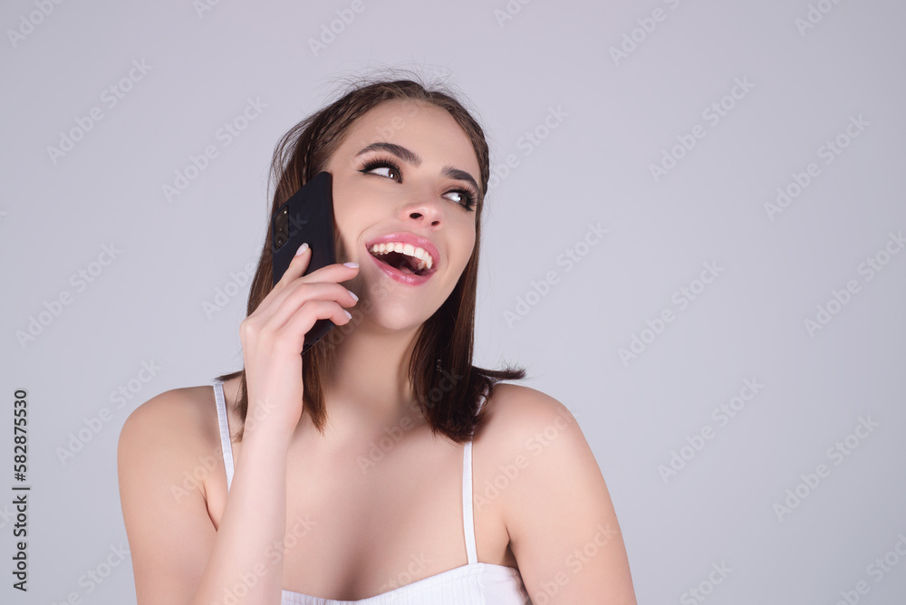 Sensual woman with phone, isolated on balcony terrace. Business woman using smartphone. Business talk. Girl using phone, chatting online. Young woman using mobile phone. Application for mobile phone. Sensual woman with phone, isolated on balcony terrace. Business woman using smartphone. Business talk. Girl using phone, chatting online. Young woman using mobile phone. Application for mobile phone.