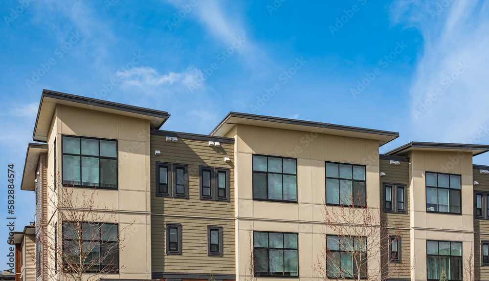 Obraz premium New residential townhouses. Modern apartment buildings in Canada. Modern complex of apartment buildings