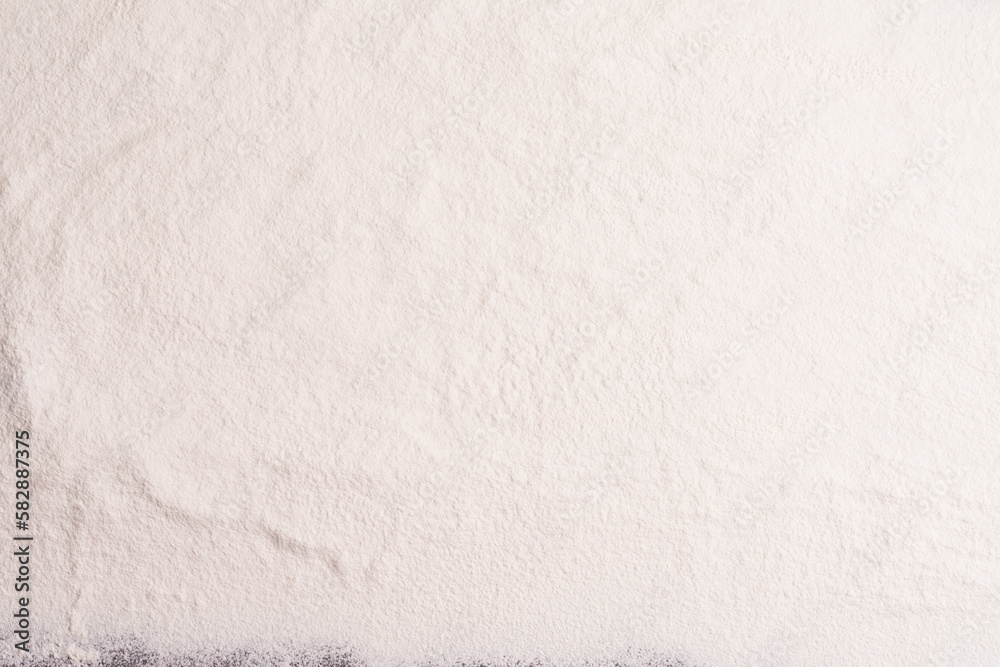 Obraz premium Wheat flour, barley, cooking, bread, and cookies are arranged on the table in a rustic kitchen, top view.