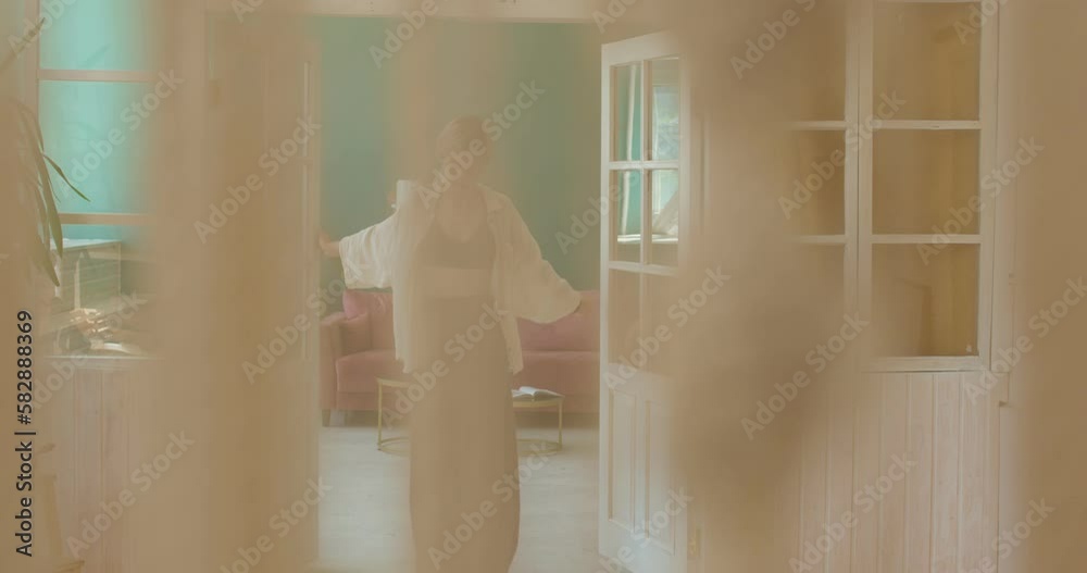 young attractive smiling woman is ready to exercise yoga class at home. camera motion, slow motion, girl enjoys doing morning exercises, girl preparing to stand on sadhu nails board young attractive smiling woman is ready to exercise yoga class at home. camera motion, slow motion, girl enjoys doing morning exercises, girl preparing to stand on sadhu nails board