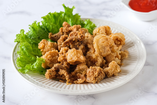 fried squid in white ceramic plate
