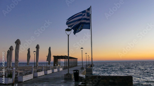 A Breathtaking View of Greece's Romantic Pier and Sunset photo