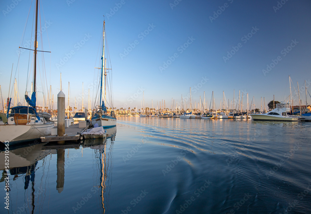 Channel Islands harbor reflections at afternoon sunset in Port Hueneme California United States