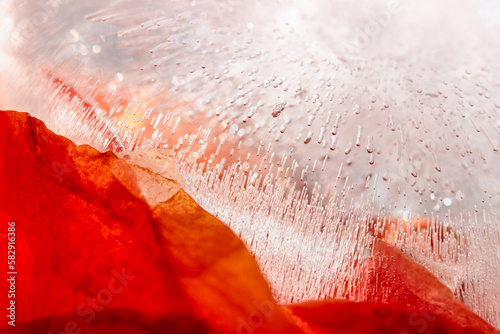 Abstract background diagonal. Red colour and ice with air bubbles texture. Macro with copy space