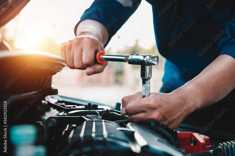 Mechanic open vehicle hood checking up auto mobile, fixing a car at home,Repair and service Mechanic open vehicle hood checking up auto mobile, fixing a car at home,Repair and service