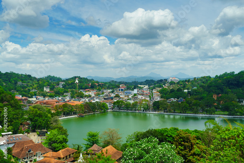 View of the city and lake among green hills