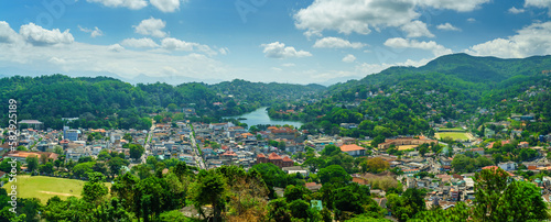 Panorama of the city among the green hills. Kandy city in Sri Lanka