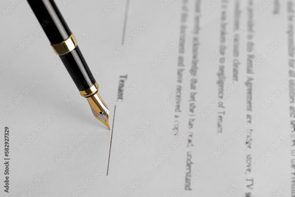 Writing on document with fountain pen, closeup. Notary contract Writing on document with fountain pen, closeup. Notary contract