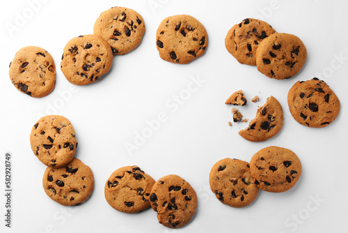 Frame made of many delicious chocolate chip cookies on white background, flat lay. Space for text