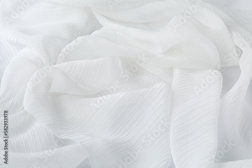 Beautiful white tulle fabric as background, closeup