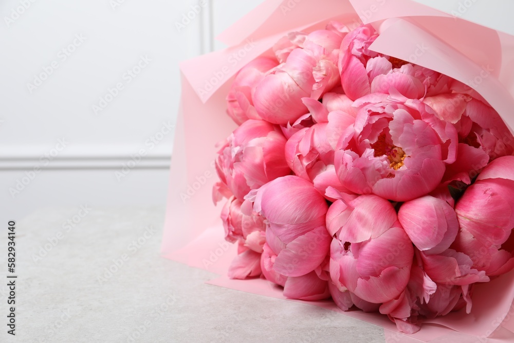 Bouquet of beautiful pink peonies on white table, closeup. Space for text Bouquet of beautiful pink peonies on white table, closeup. Space for text