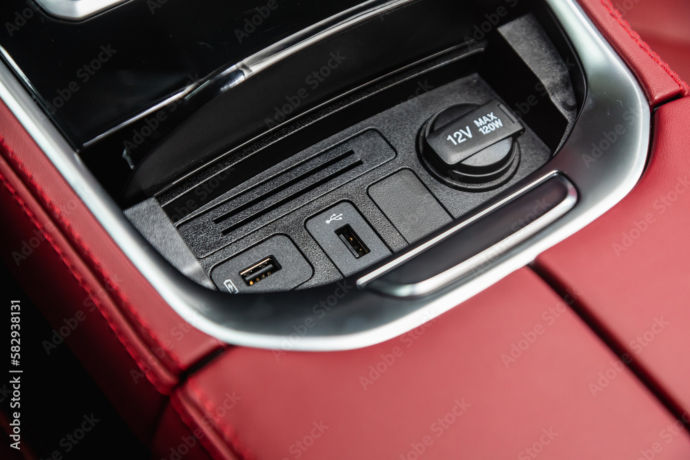  Close up of a charging in the car,  usb connector . modern car interior