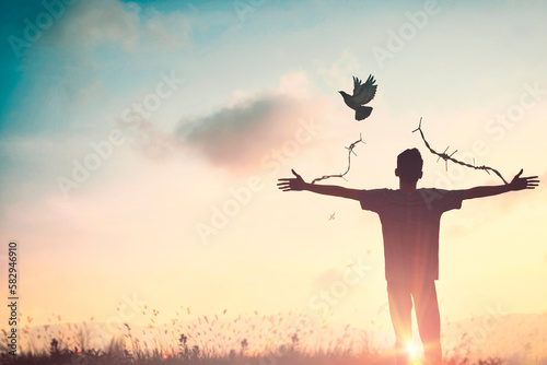 Happy man rise hand on morning view. Christian inspire praise God on good friday background. Now one man self confidence on peak open arms enjoying nature the sun concept world wisdom fun hope