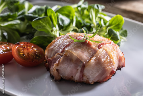 Camambert and bacon wrap fried until crispy served with green salad and cherry tomatoes
