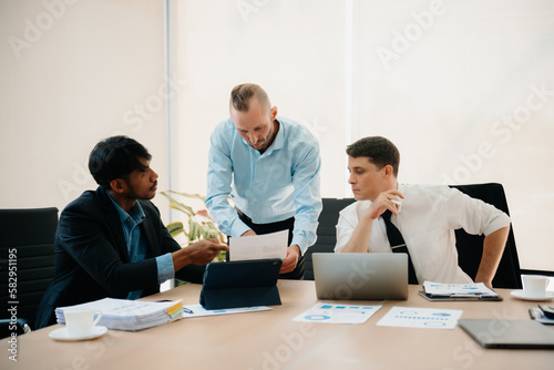  Business people sum up the results of their work in the company during the year, new project in office.