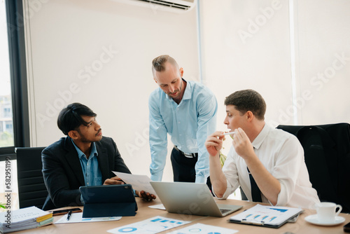  Business people sum up the results of their work in the company during the year, new project in office.