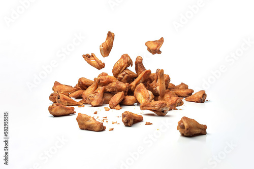 Tasty falling fried spicy chicken wings isolated on white background. Created with Generative AI Technology