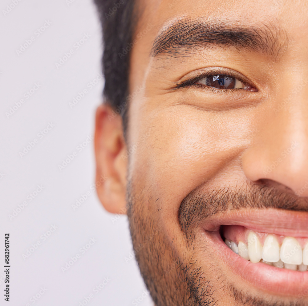 Obraz premium Half, face and teeth of a man with dental, oral and mouth hygiene isolated against a studio white background. Smile, clean and whitening treatment for a happy male feeling excited and confident