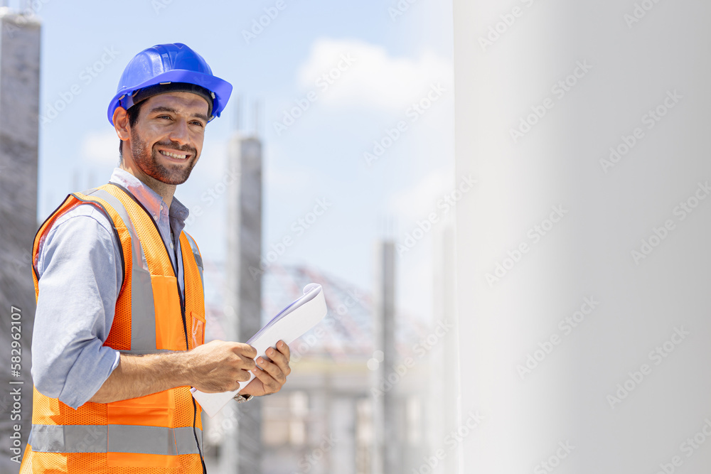 Portrait of handsome successful architect standing with arms crossed in building in construction process. Portrait of handsome successful architect standing with arms crossed in building in construction process.