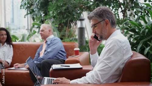 businessman works on a laptop with financial data.