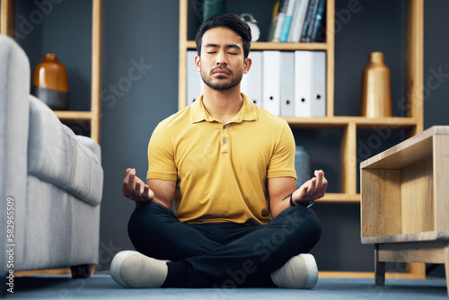 Meditation, zen and relax, man on living room floor with calm breathing exercise and time for mind wellness. Peace, balance and Indian person in lounge to meditate with concentration and mindfulness.