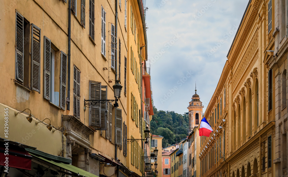 Obraz premium Restaurants and bars in old houses on a street in Old Town Nice, France