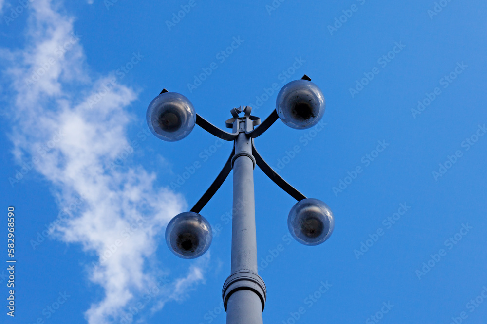 old metal street lamp with four lights old metal street lamp with four lights
