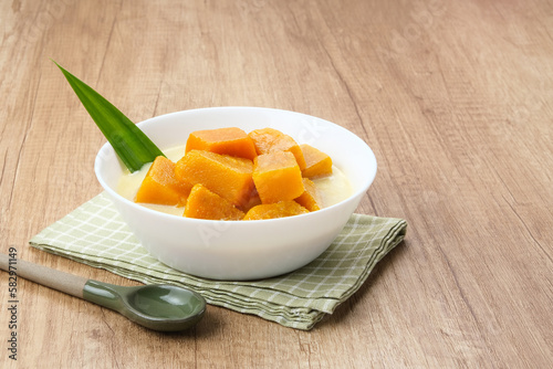 Kolak Waluh or Kolak Labu Kuning, Indonesian traditional food. Pumpkin in sweet coconut milk. Popular during ramadan
 photo