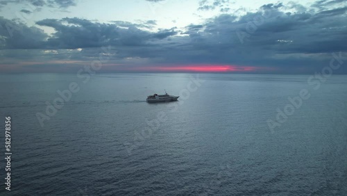 Ship at sunset on the high seas photo